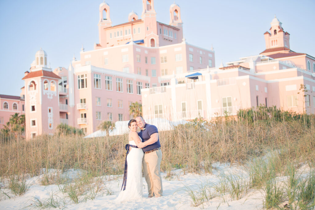 Bride and groom wedding portrait with The Don CeSar hotel in the background