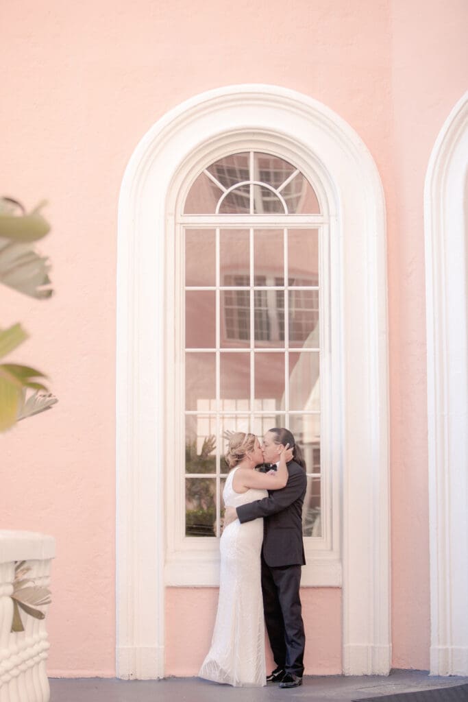Wedding portrait against pink wall at The Don CeSar