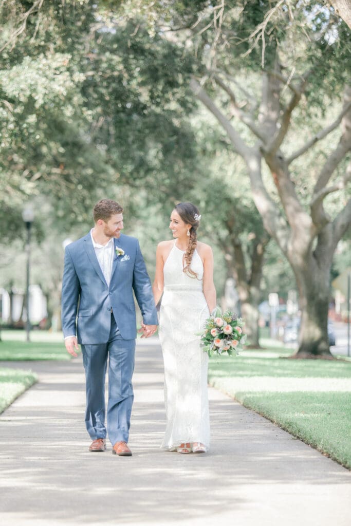 Bride and groom walking near Museum of Fine Arts in St Petersburg