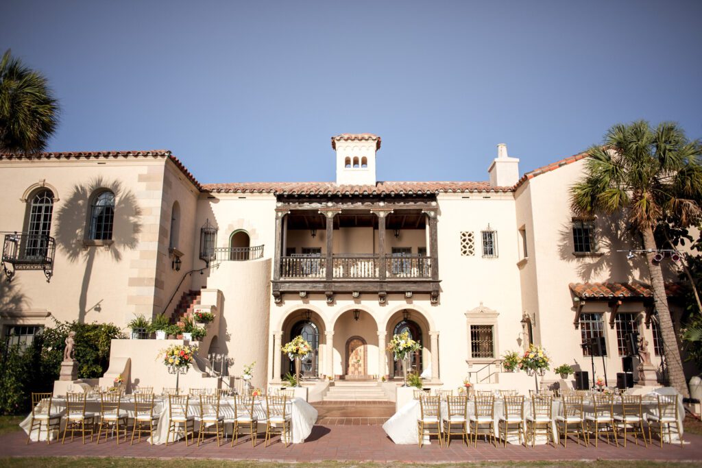 Powel Crosley Estate wedding ceremony setup in Sarasota Florida with waterfront lawn and Mediterranean architecture