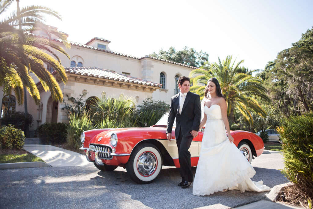 bride and groom with vintage car at Powel Crosley Estate Sarasota wedding