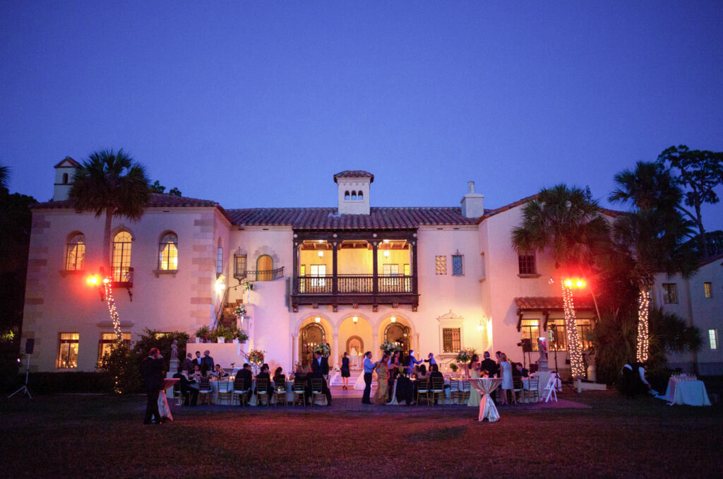 Powel Crosley Estate wedding reception at night with courtyard lighting Sarasota Florida