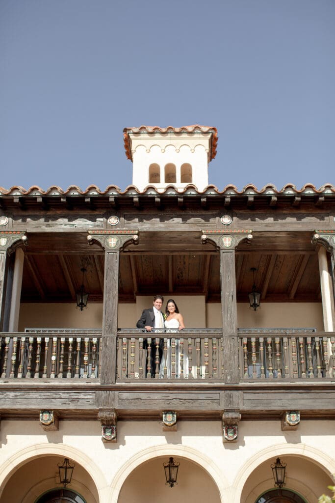 Bride and groom on balcony at Powel Crosley Estate wedding
