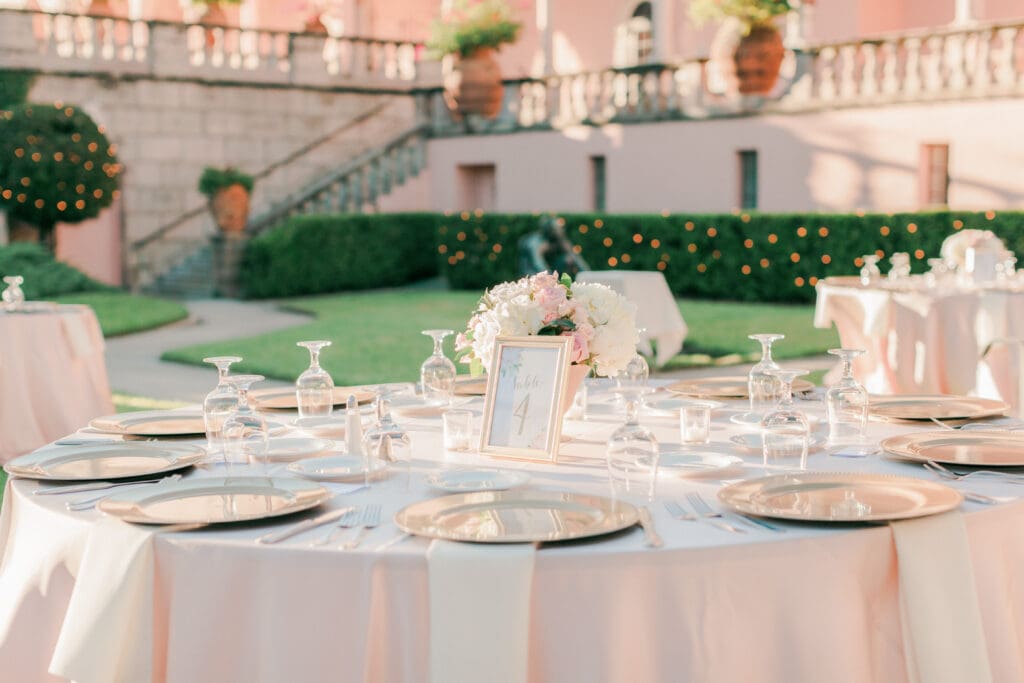 Elegant outdoor wedding reception setup in the courtyard at The Ringling Museum in Sarasota Florida