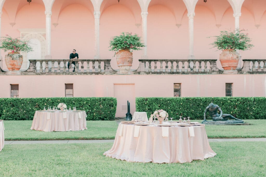 Elegant outdoor wedding reception setup in the courtyard at The Ringling Museum in Sarasota Florida