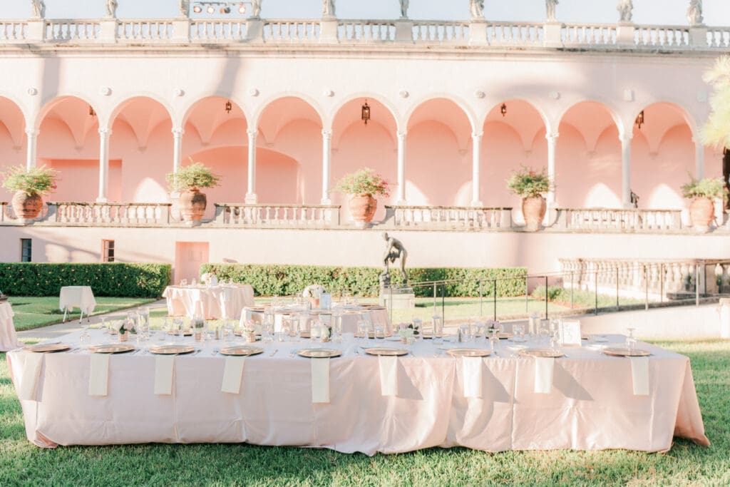 Elegant outdoor wedding reception setup in the courtyard at The Ringling Museum in Sarasota Florida