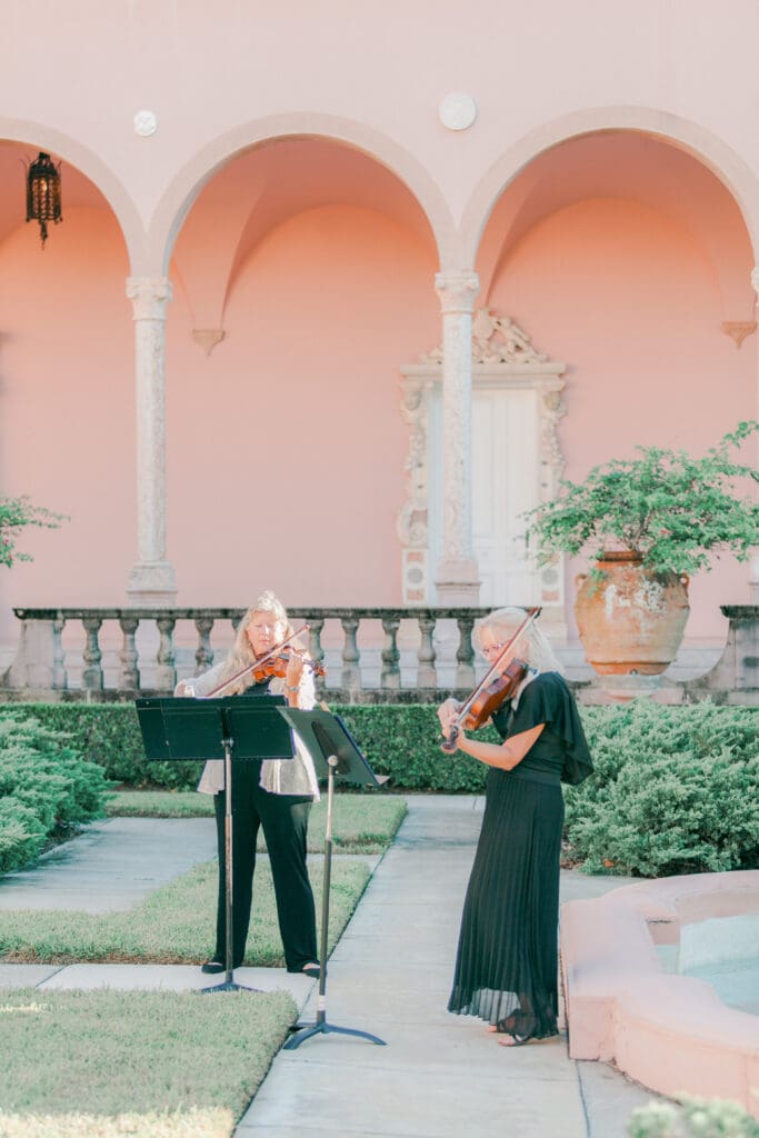 Elegant outdoor wedding reception setup in the courtyard at The Ringling Museum in Sarasota Florida