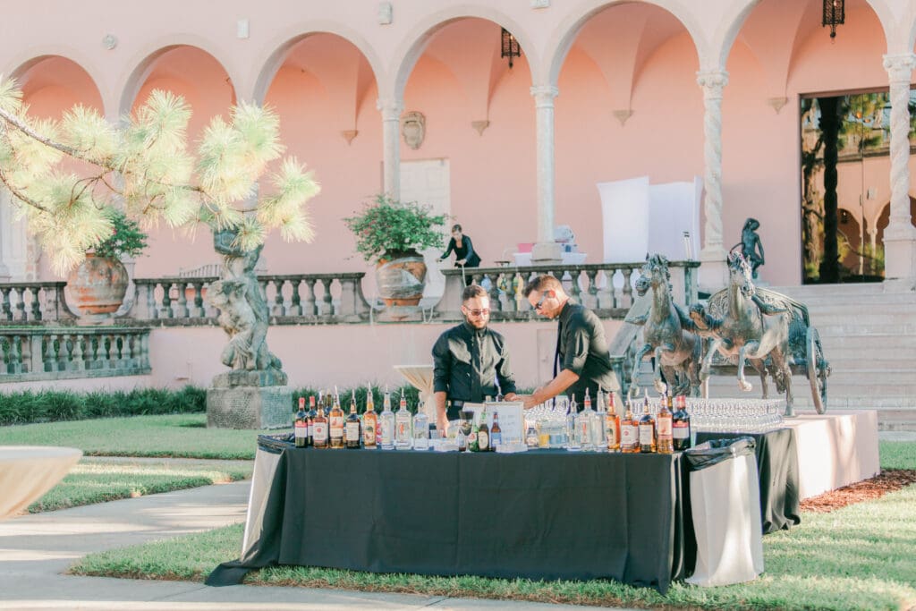 Elegant outdoor wedding reception setup in the courtyard at The Ringling Museum in Sarasota Florida