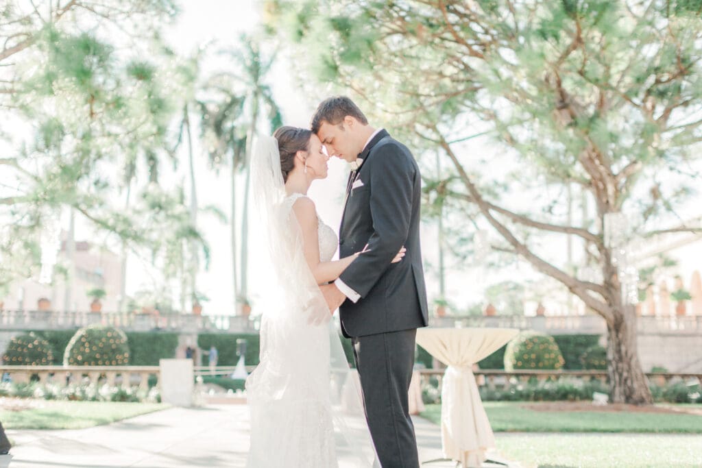 Bride and groom sharing a quiet moment together in the courtyard at The Ringling Museum in Sarasota Florida