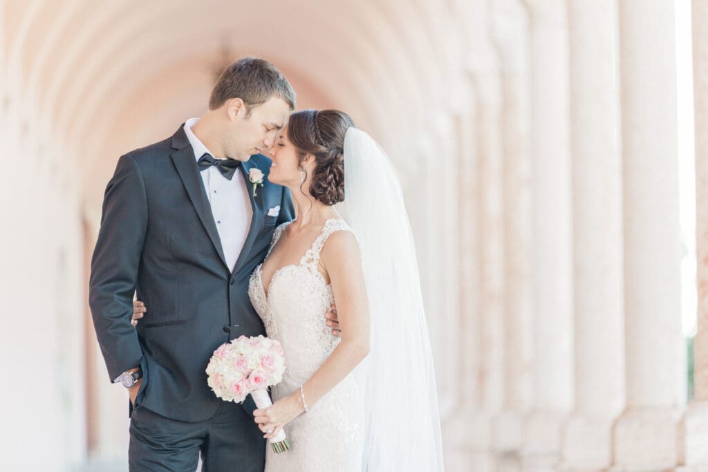 Romantic bride and groom portrait beneath the coral arches at The Ringling Museum in Sarasota Fl