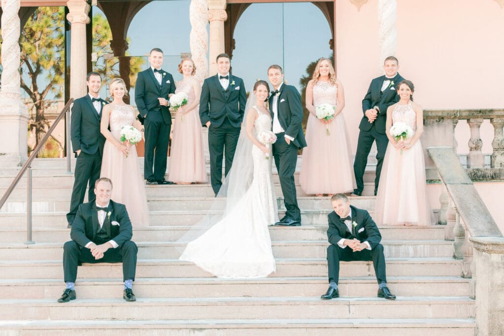 Bridal party portraits beneath the historic arches at The Ringling Museum courtyard in Sarasota Florida