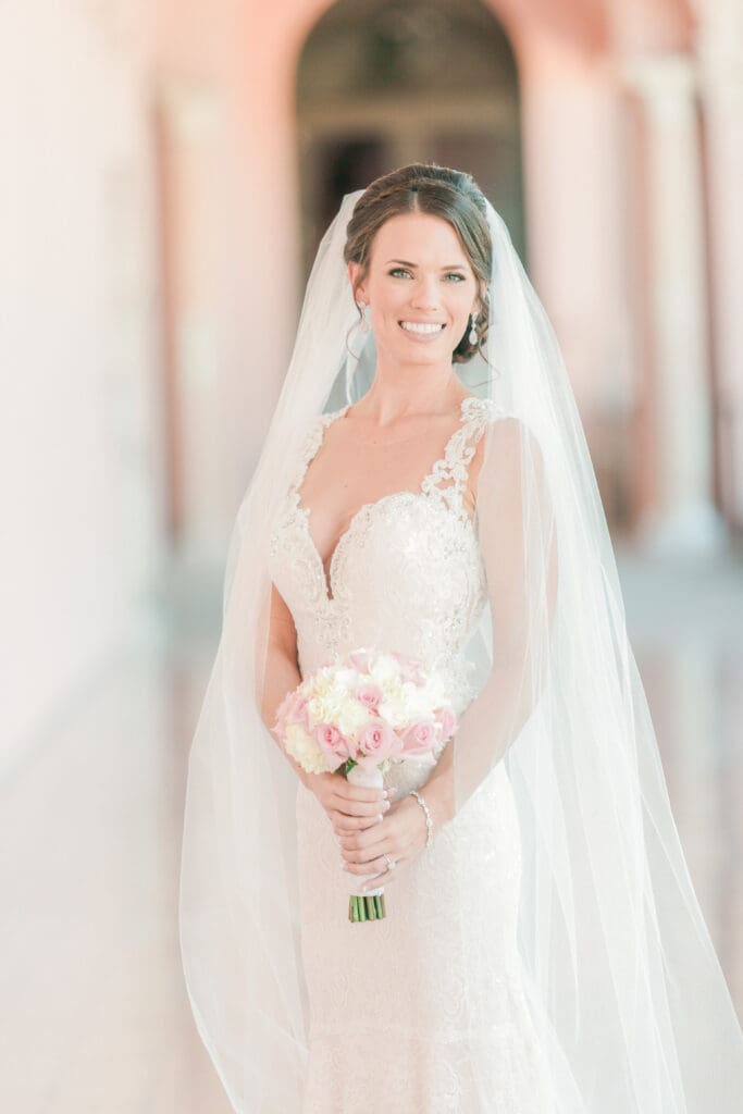 Elegant bride portrait beneath the archways at The Ringling Museum in Sarasota Florida