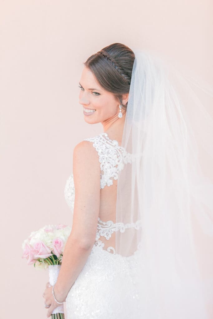 Elegant bride portrait beneath the archways at The Ringling Museum in Sarasota Florida