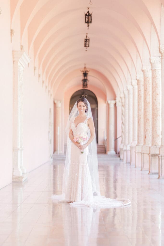 Elegant bride portrait beneath the archways at The Ringling Museum in Sarasota Florida