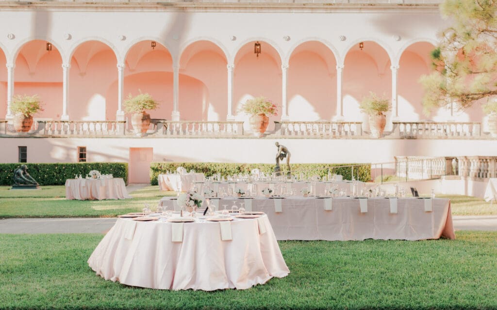 Elegant outdoor wedding reception setup in the courtyard at The Ringling Museum in Sarasota Florida