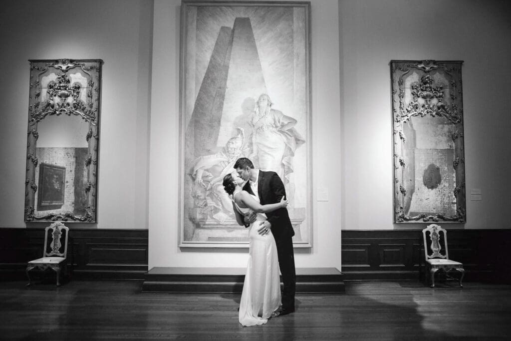 Black and white wedding portrait inside The Ringling Museum gallery
