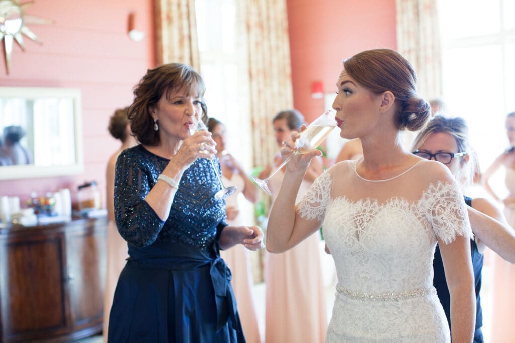 Bridesmaids helping bride get ready at Colleton River Club wedding