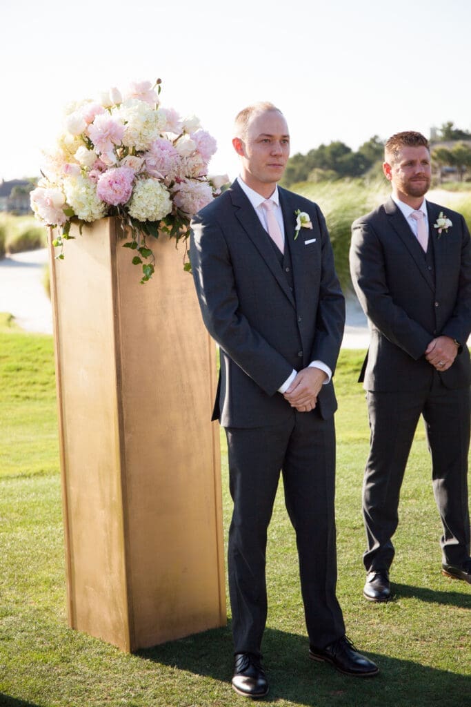 Groom waiting during waterfront wedding ceremony in Hilton Head
