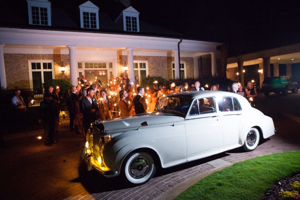 Vintage getaway car outside wedding reception
