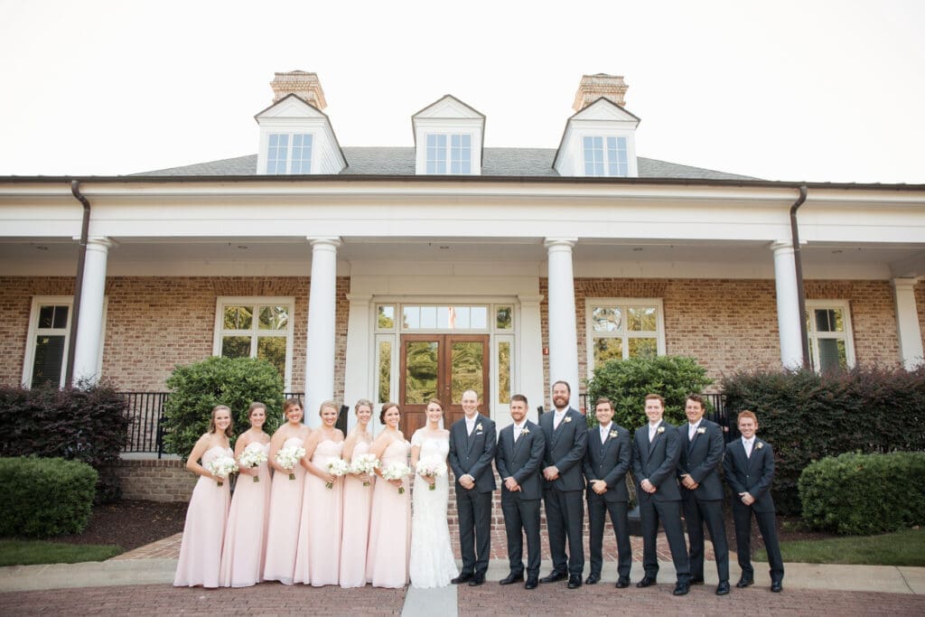 Wedding party portrait outside Southern coastal wedding venue